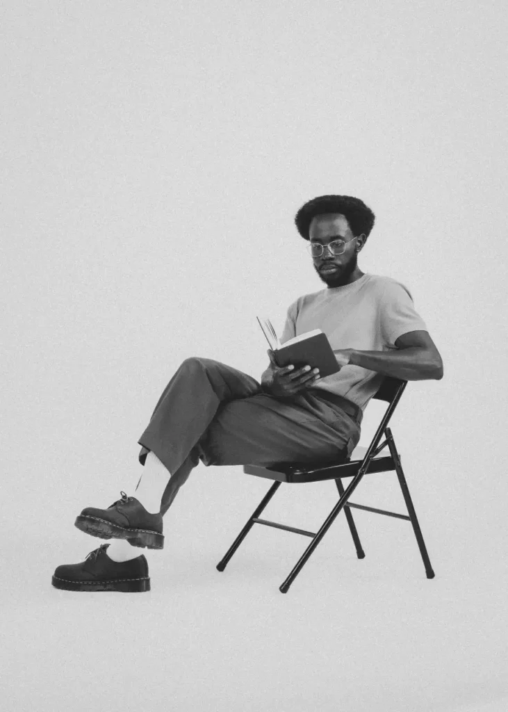 Mike Bosco black and white portrait sitting reading journal